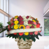 Cuscino funebre misto con girasoli e rose, composizione su sostegno per una cerimonia a Bologna