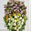 Cuscino funebre di fiori bianchi, gialli, lilla e arancio con nastro per la dedica, composizione funebre a Bologna